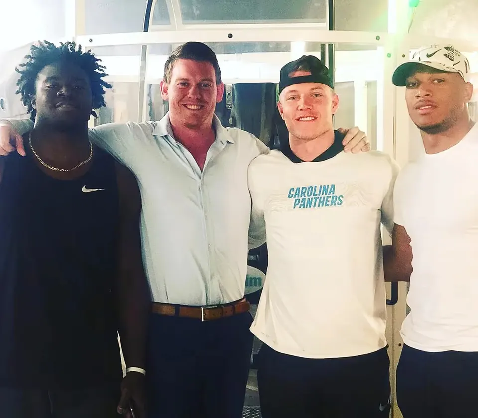 Christian McCaffrey and DJ Moore with Dr. Jeff McWhorter at True Performance