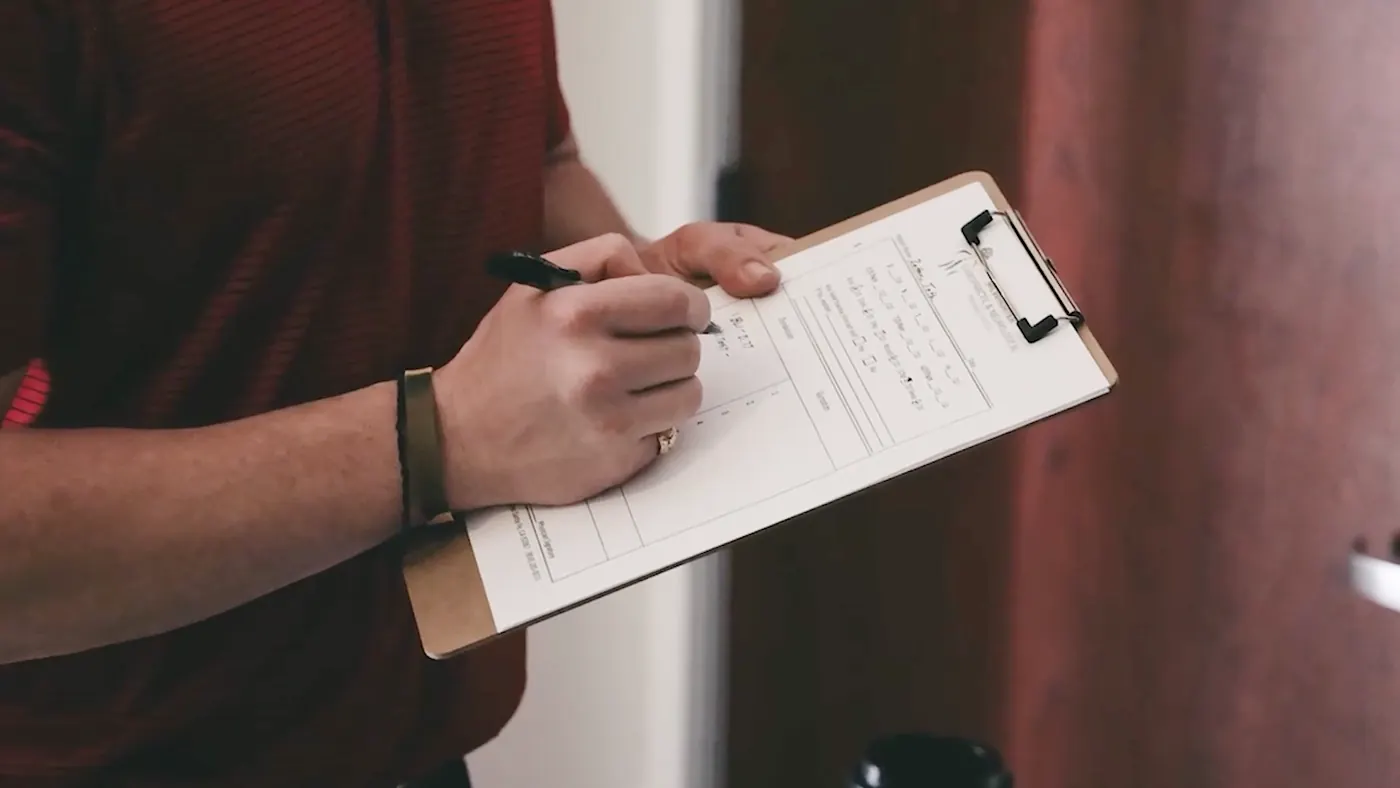 Dr. McWhorter writing notes on a clipboard