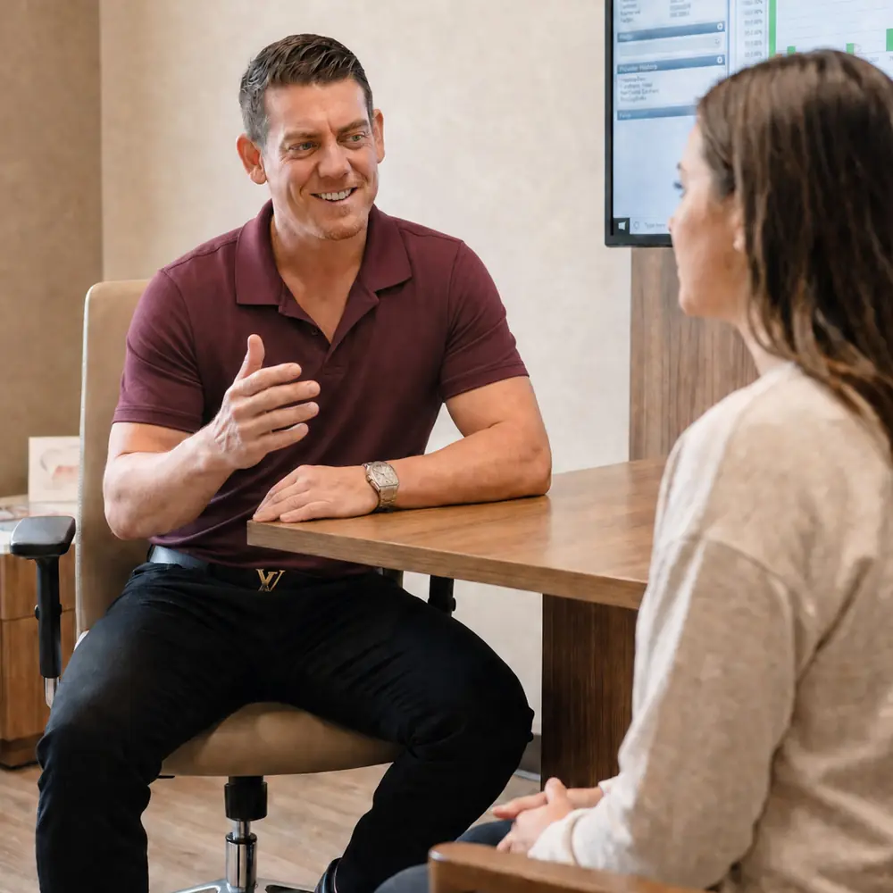 A clinician talking through findings with a patient