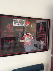 Framed signed memorabilia on the clinic wall