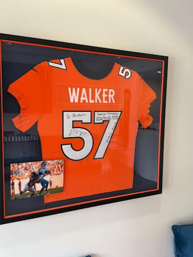A signed number 57 jersey on the clinic wall
