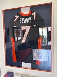 A signed football jersey on the clinic wall